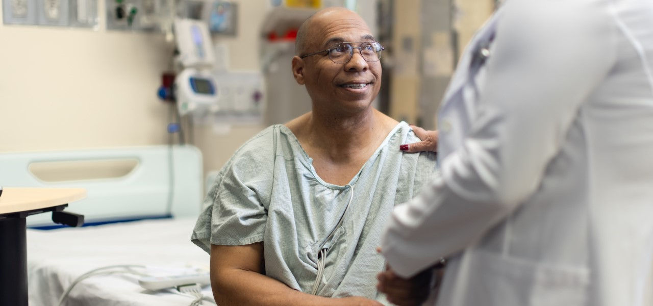 Happy patient talking to a doctor