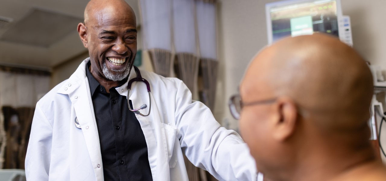 Caregiver taking care of happy patient