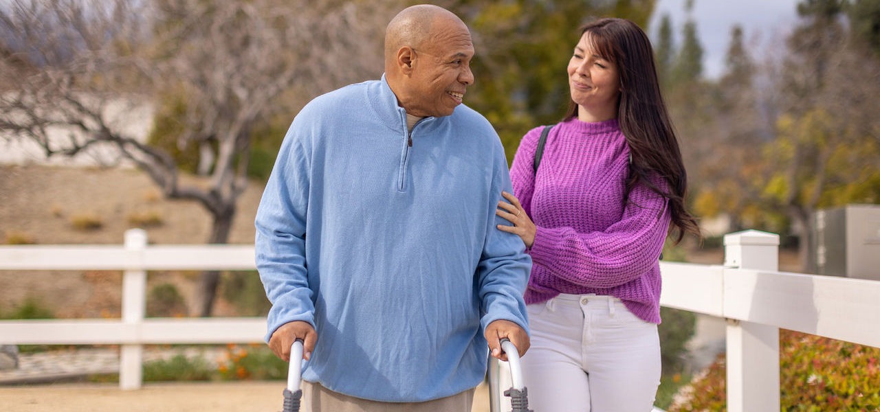 Happy patient walking with walker