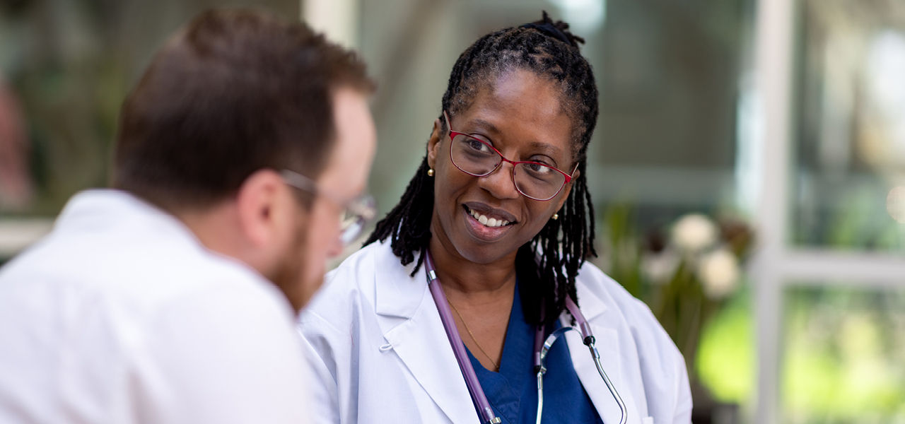Two Health Care Professionals in Conversation
