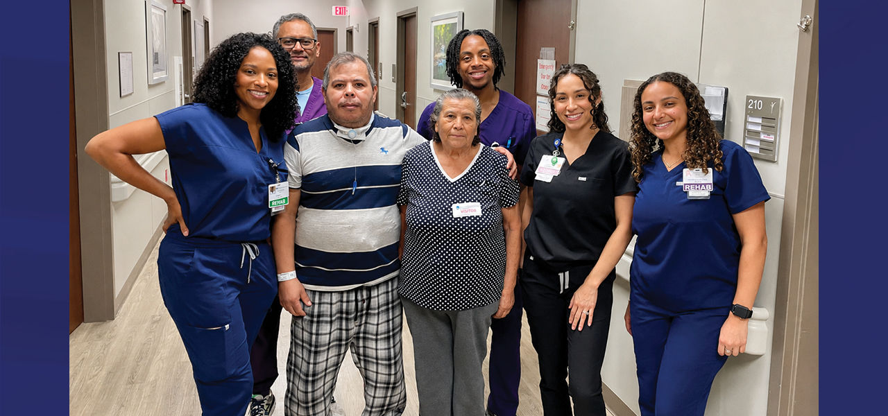 Kindred Hospital Dallas Central patient Alejandro stands with his care team