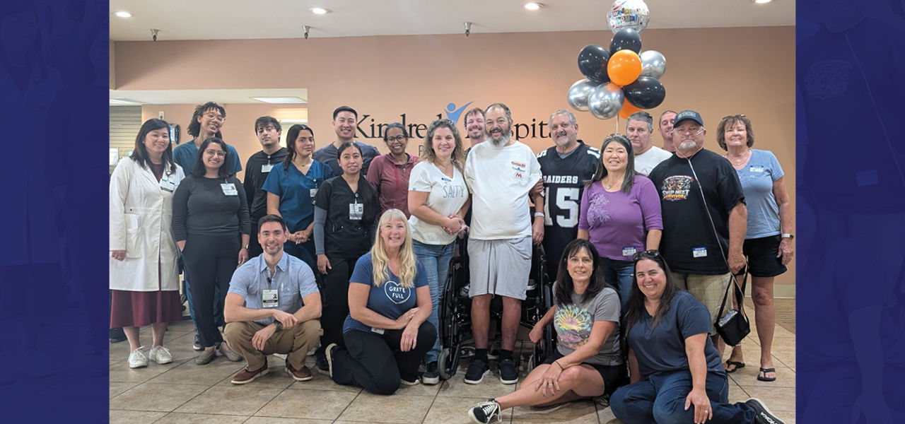 Kindred Hospital Paramount patient Mauricio stands with his care team celebrating his recovery from a motorcycle wreck