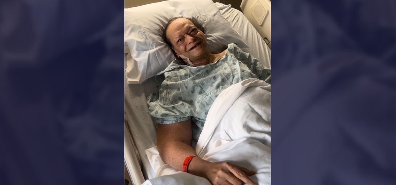 Happy patient leaving hospital with caregivers