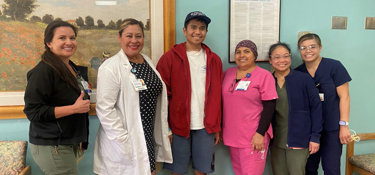 Kindred Hospital Westminster patient Andre stands with his support team that helped him recover from traumatic brain injury
