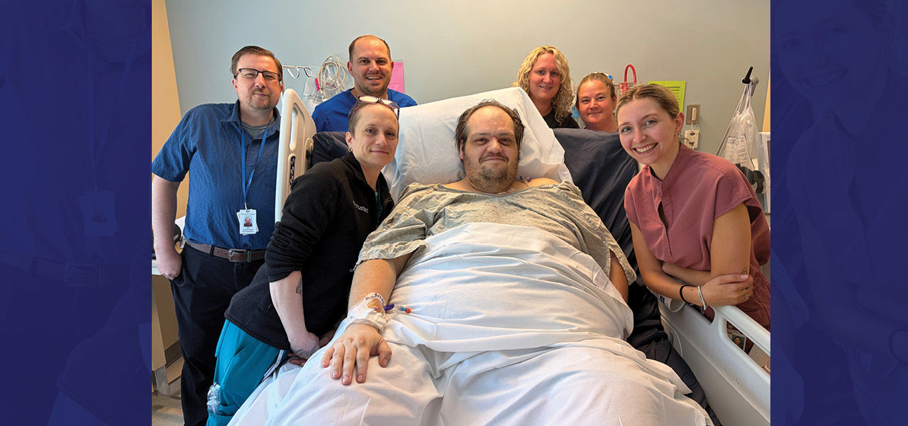 Kindred Hospital Northland patient Andrew poses with his care team