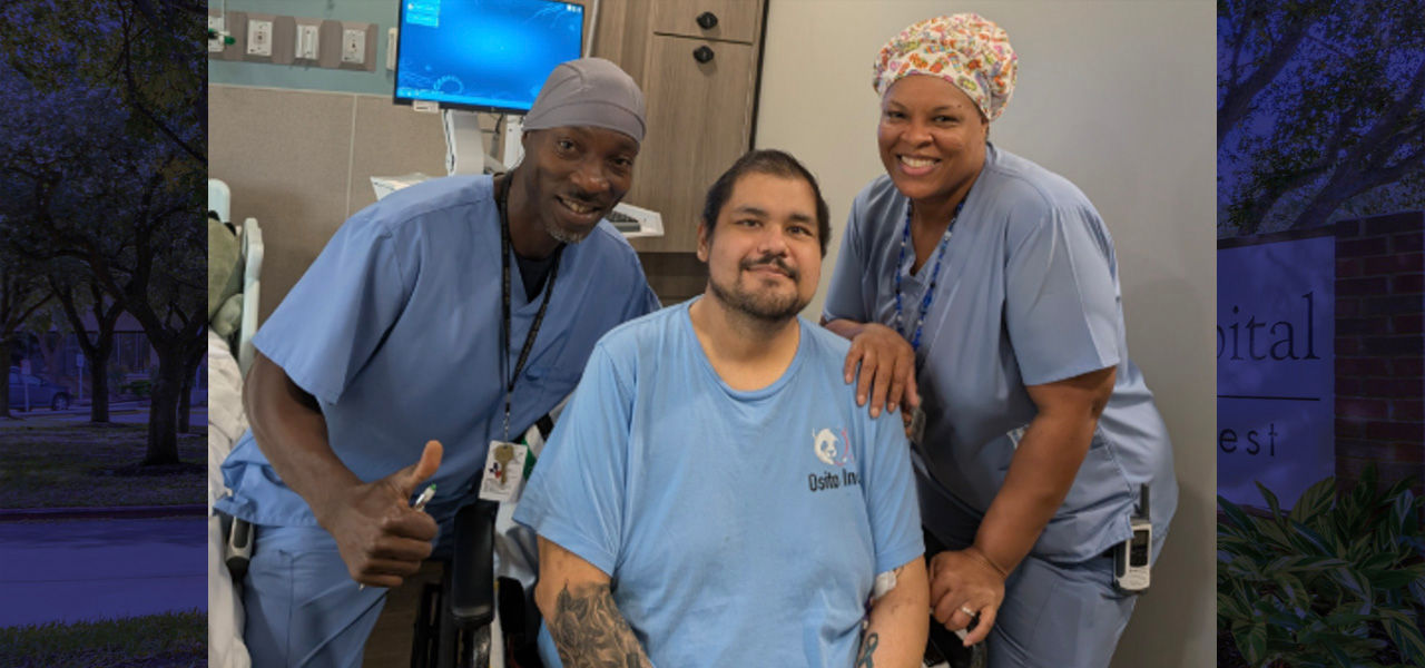 Kindred Hospital Houston Northwest patient Andrew poses with his care team