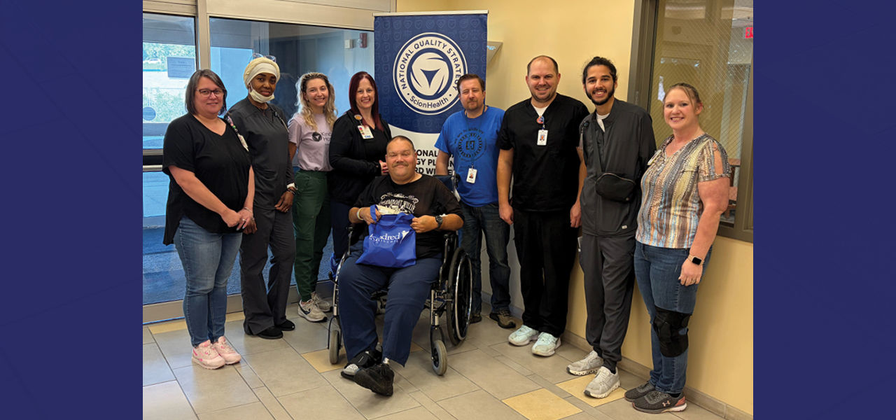 Kindred Hospital Northland patient Anthony poses with his care team