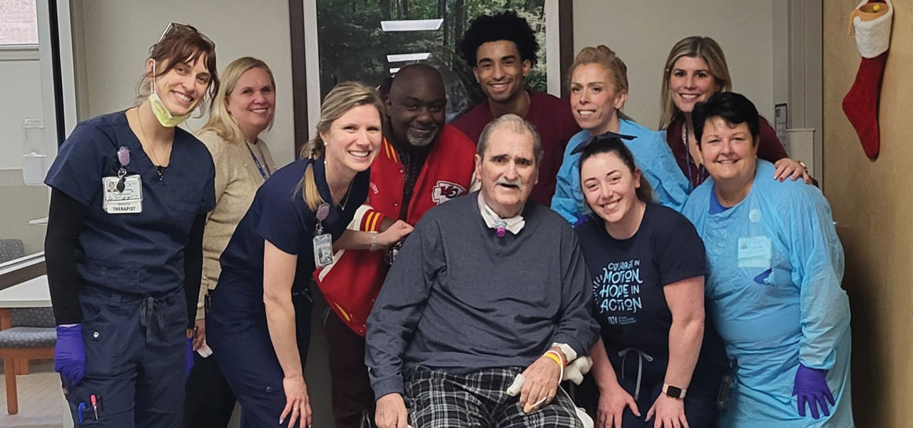 Kindred Hospital Havertown patient Arthur poses with his care team