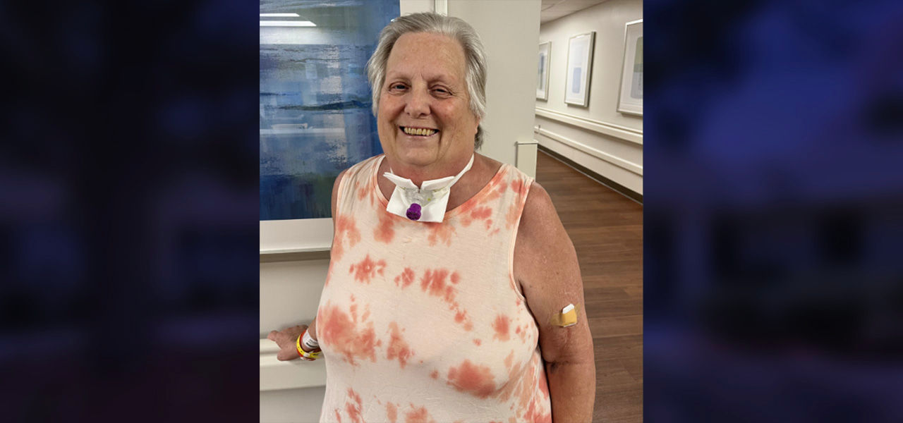 Happy Patient standing in hospital halls after successful ventilator weaning