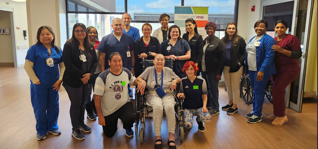 Happy patient leaving hospital with caregivers