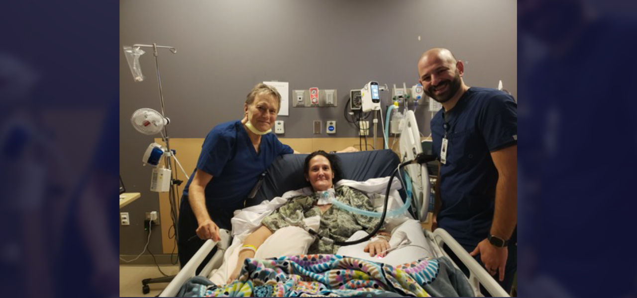 Happy patient leaving hospital with caregivers