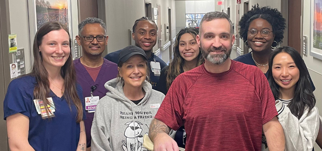 Kindred Hospital Dallas Central Patient Brent stands with his care team