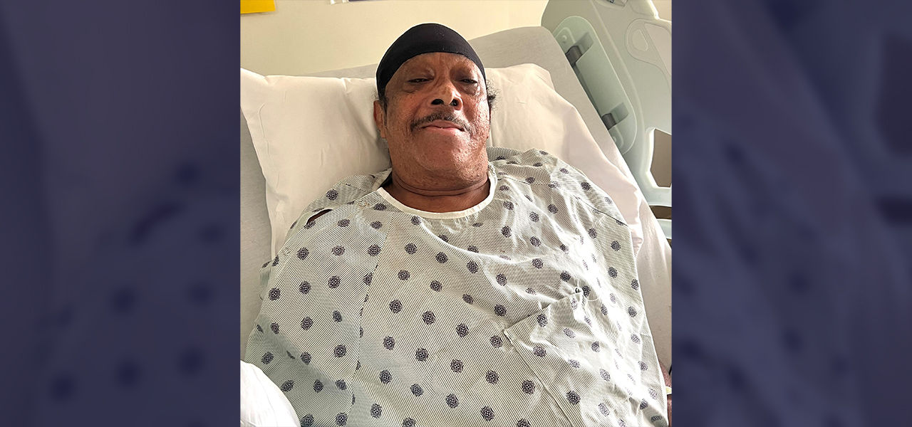 Happy patient leaving hospital with caregivers