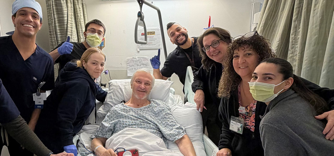 Kindred Hospital East New Jersey patient Carlo poses with his care team