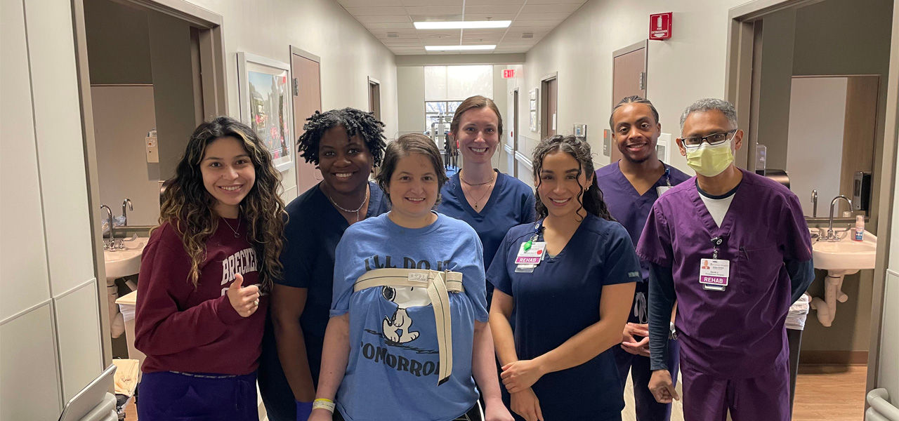 Kindred Hospital Dallas Central patient Carrie stands with her care team