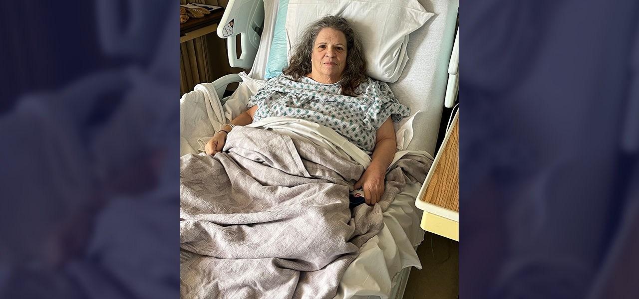 Happy patient leaving hospital with caregivers