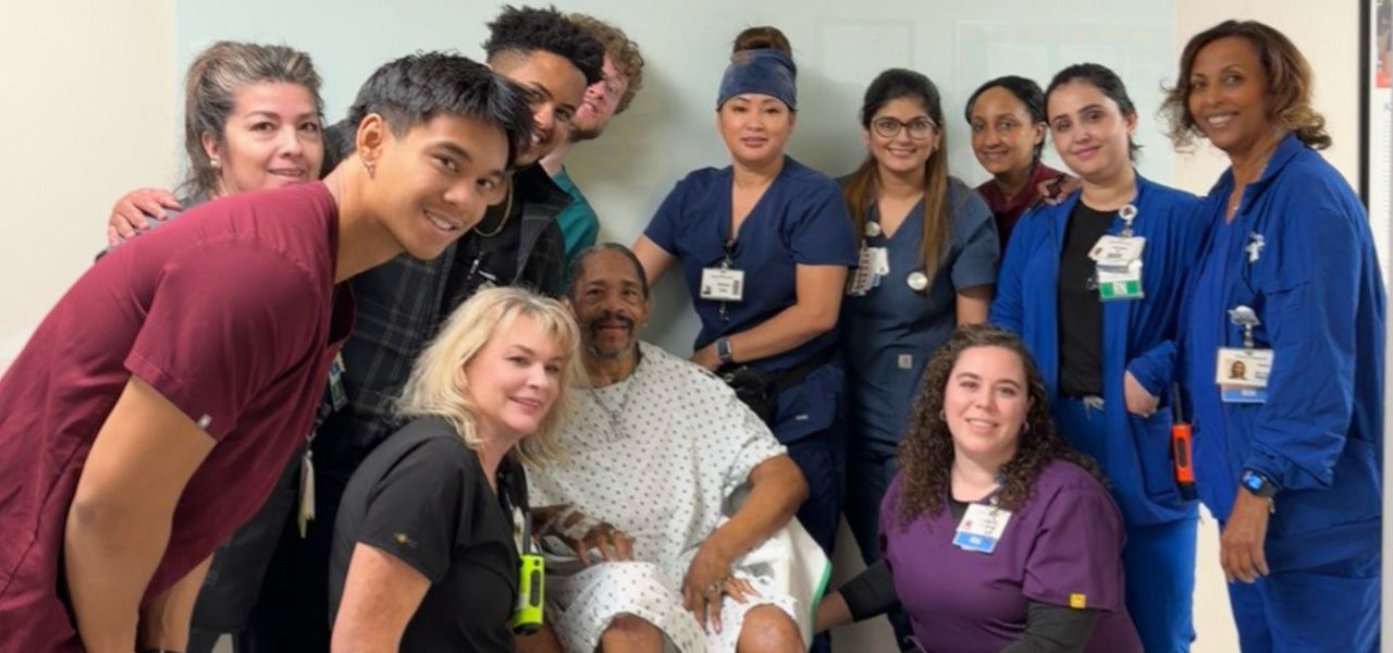 Kindred Hospital Aurora patient Charles poses with his care team