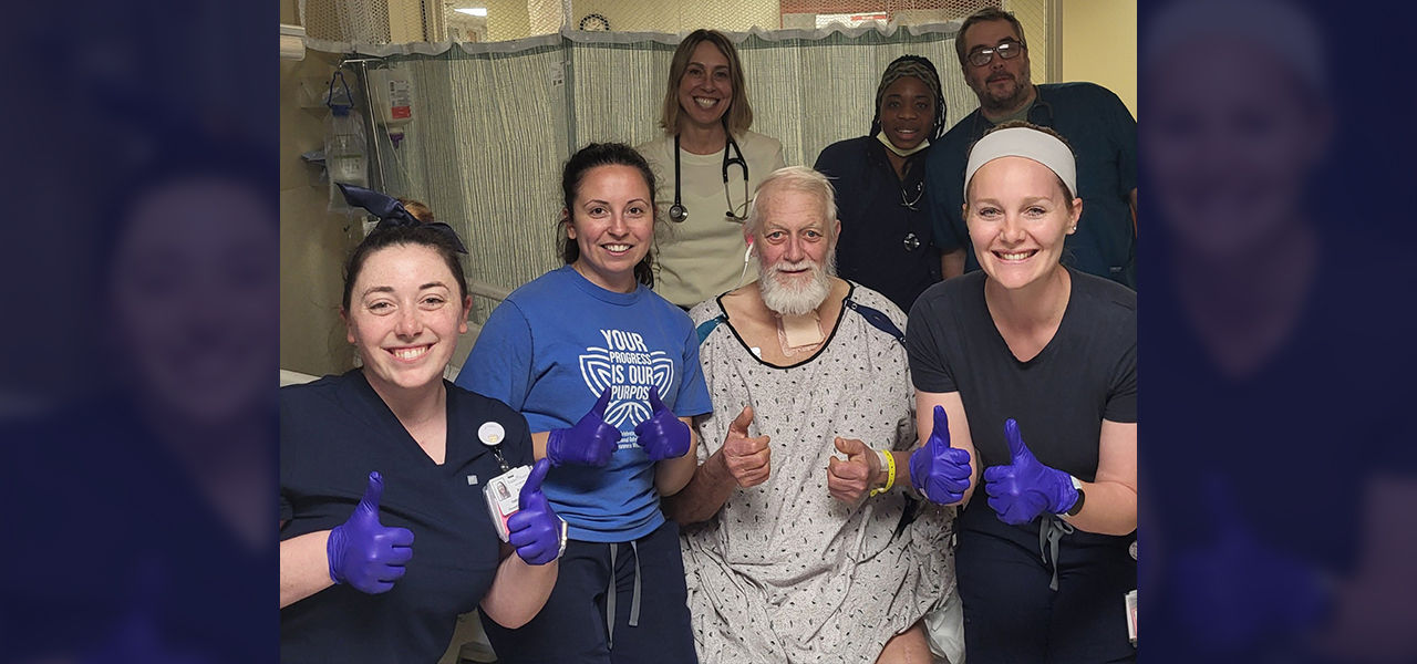 Happy patient leaving hospital with caregivers