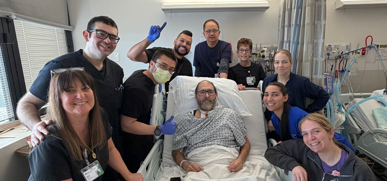 Kindred Hospital East New Jersey patient Christian poses with his care team