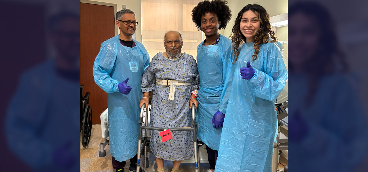 Happy patient leaving hospital with caregivers