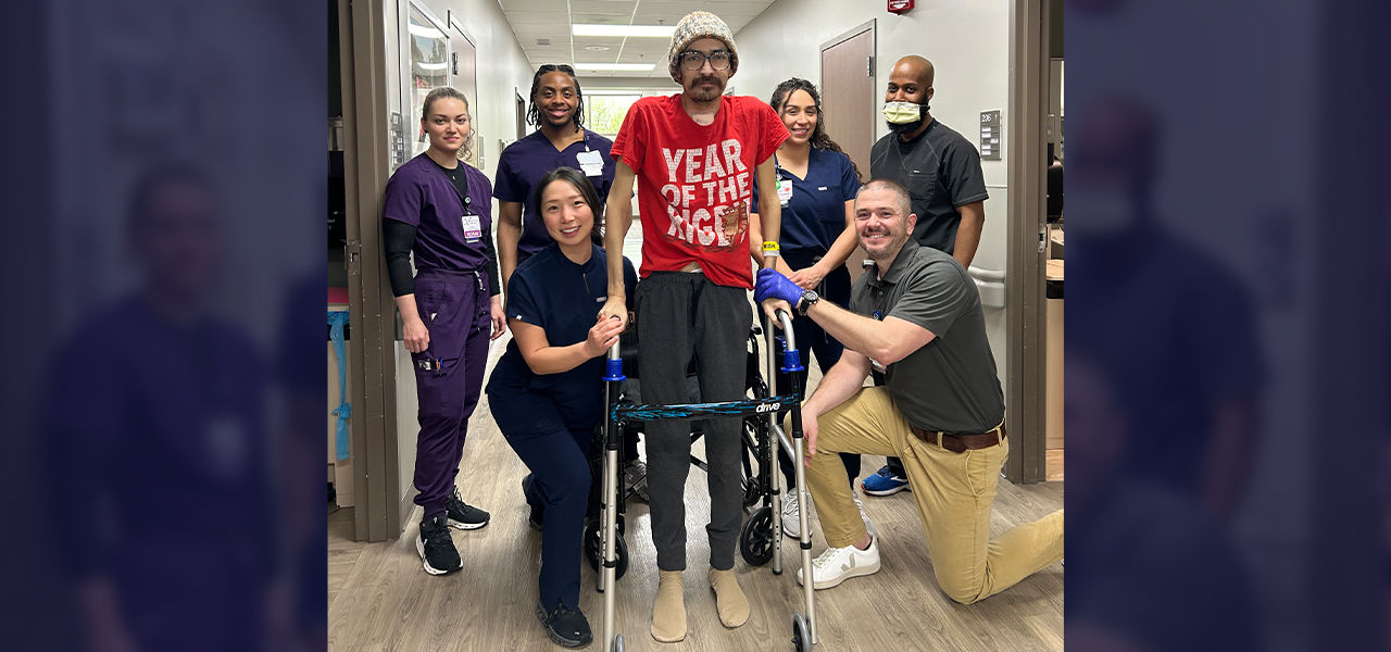 Happy patient leaving hospital with caregivers