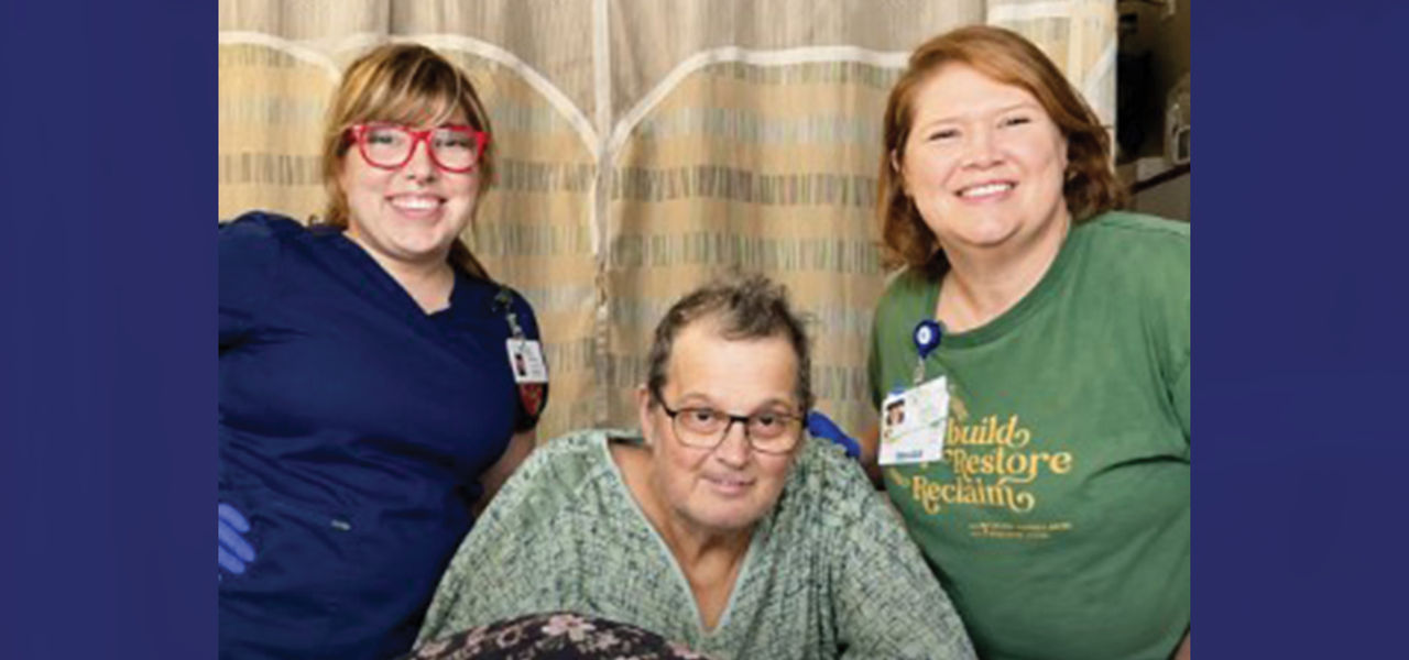 Kindred Hospital St Louis South patient David poses with his care team