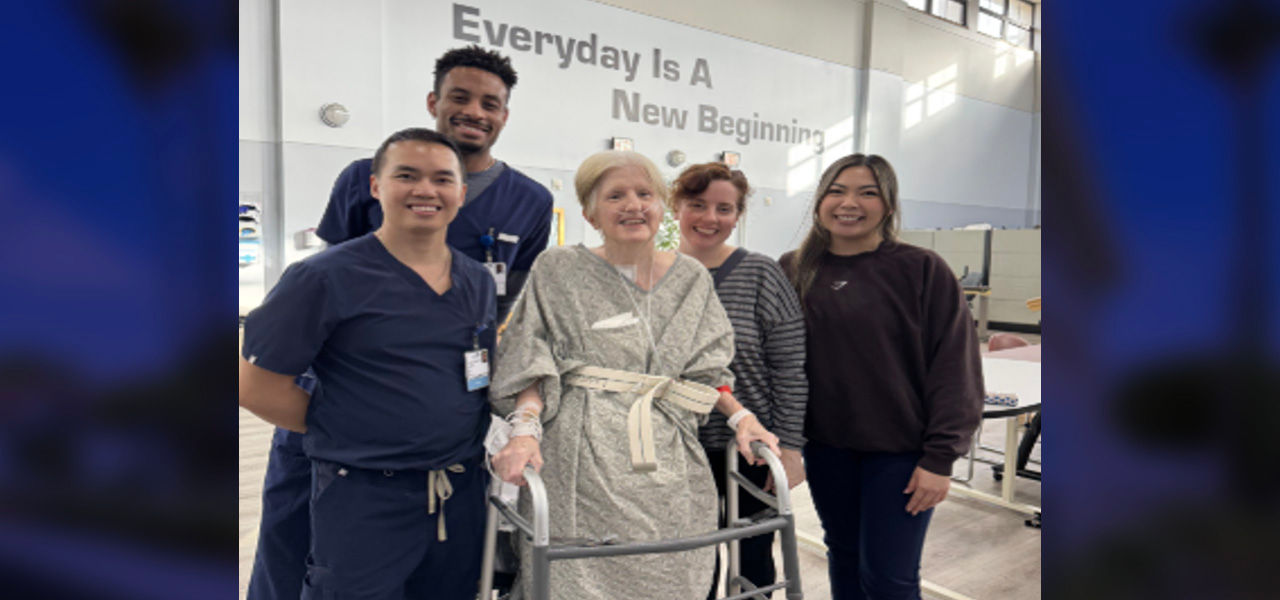 Kindred Hospital Brea patient Deanna poses with her care team