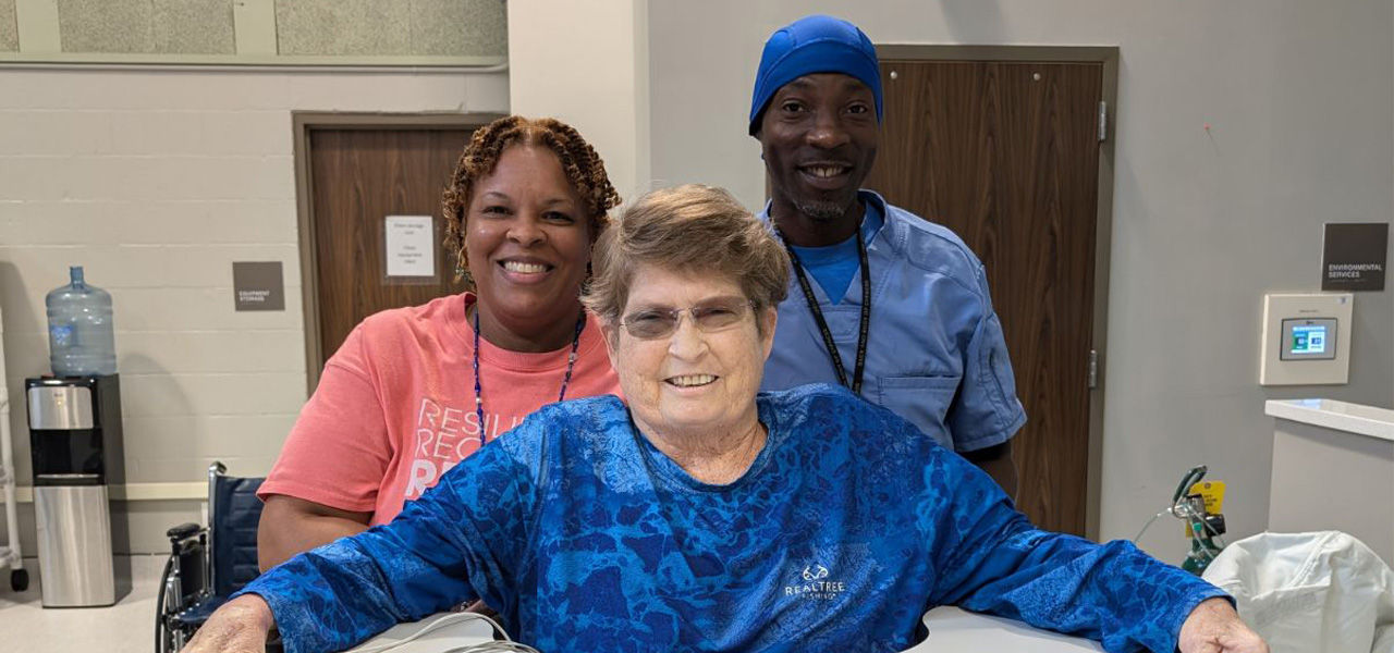 Kindred Hospital Houston Northwest patient Deborah poses with her care team