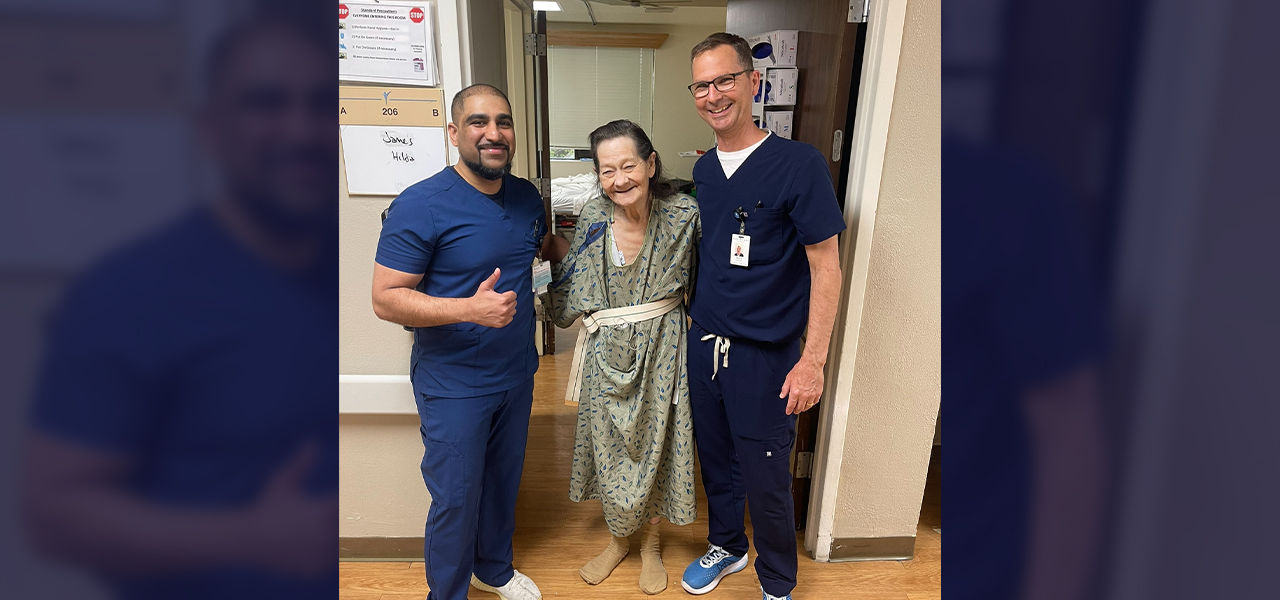 Happy patient leaving hospital with caregivers