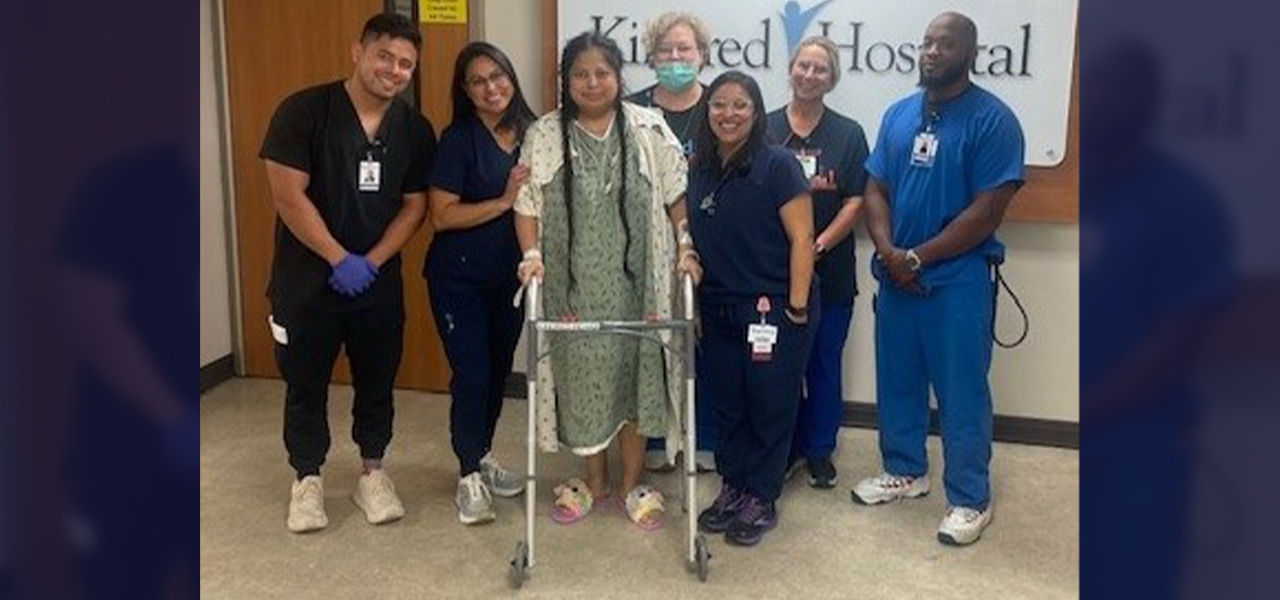 Happy patient leaving hospital with caregivers