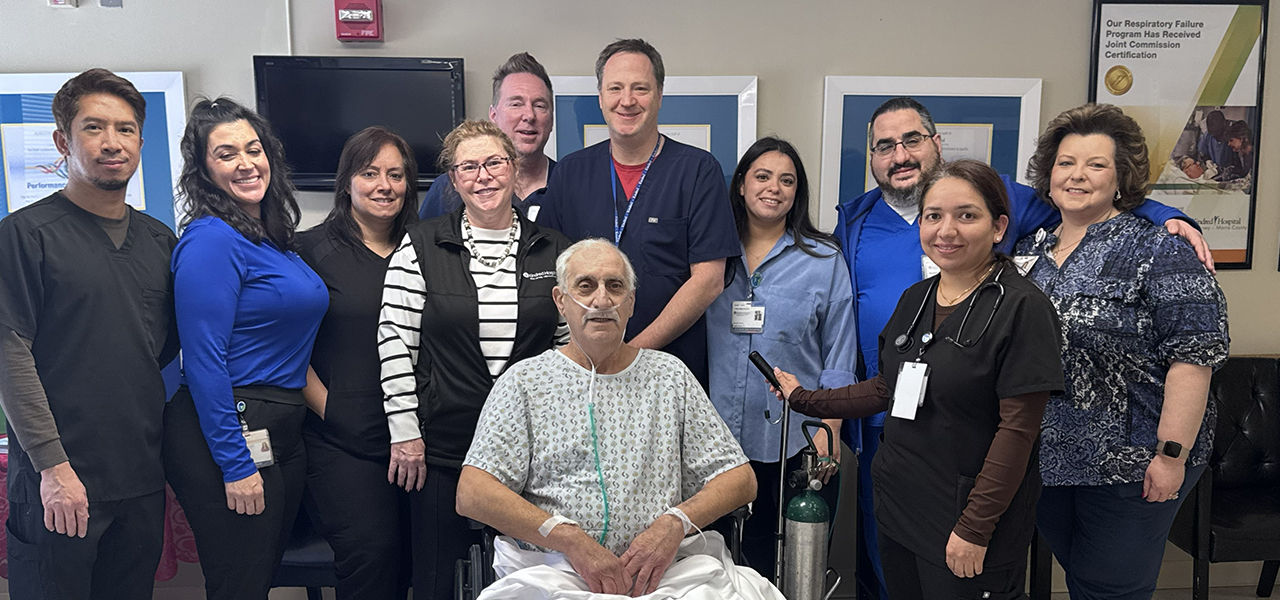 Kindred Hospital New Jersey Morris County patient Dominic poses with his care team and shares his story of recovery