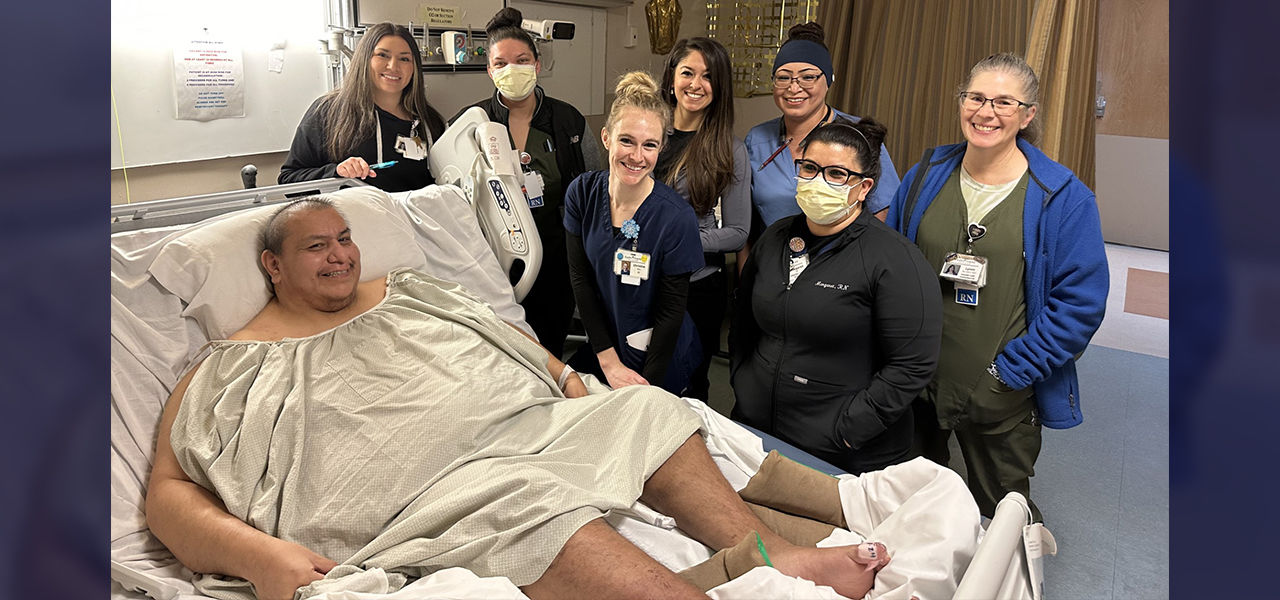 Happy patient leaving hospital with caregivers