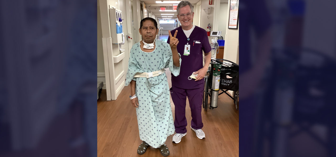 Happy patient leaving hospital with caregivers