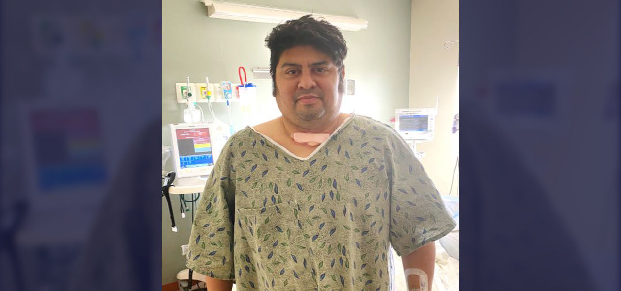 Happy patient standing in hospital room