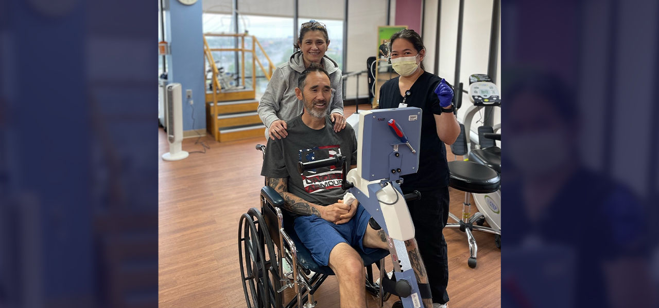 Happy patient leaving hospital with caregivers