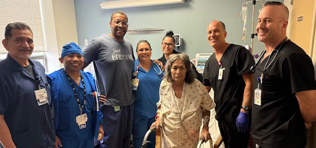 Kindred Hospital San Antonio Central patient Irene stands with her care team