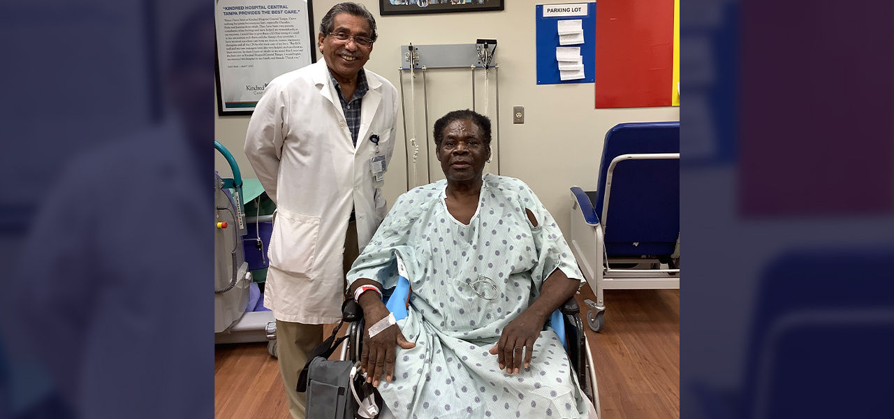 Happy patient leaving hospital with caregivers