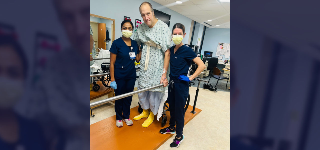 Happy patient with caregivers doing physical therapy