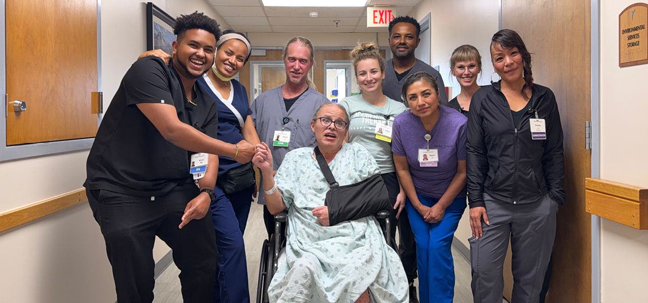Kindred Hospital Aurora patient Jeremy poses with his care team