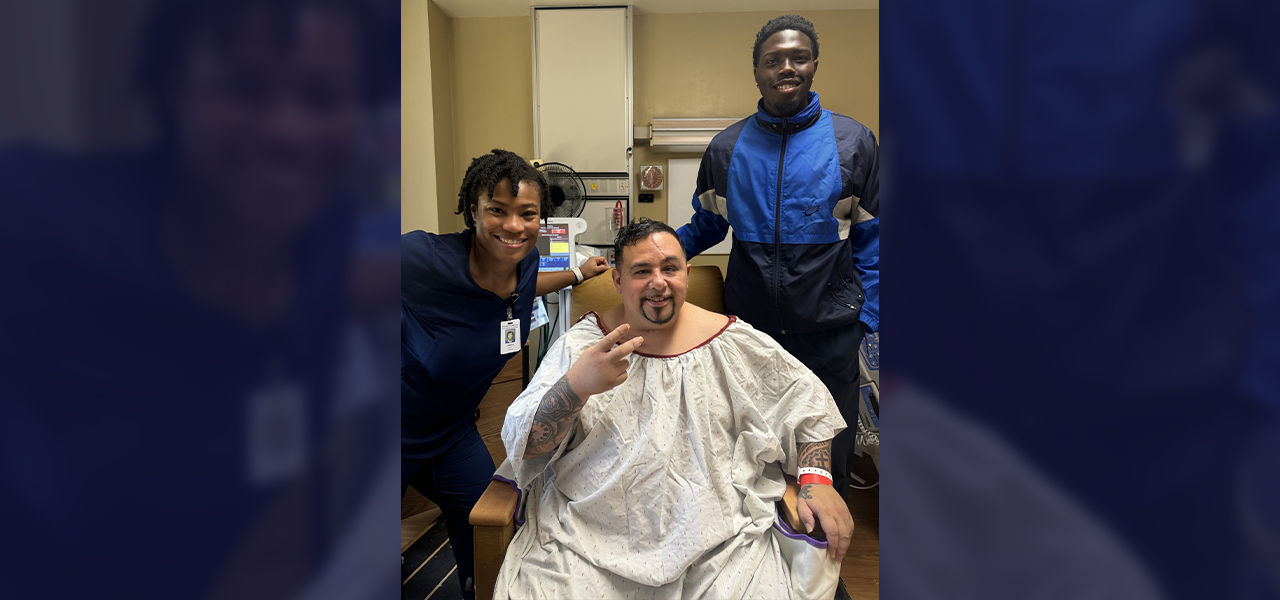 Happy patient leaving hospital with caregivers