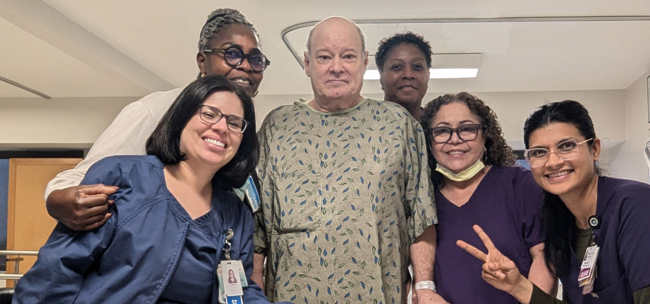 Kindred Hospital Tarrant County Arlington patient John stands with his support staff that helped him recover from stroke