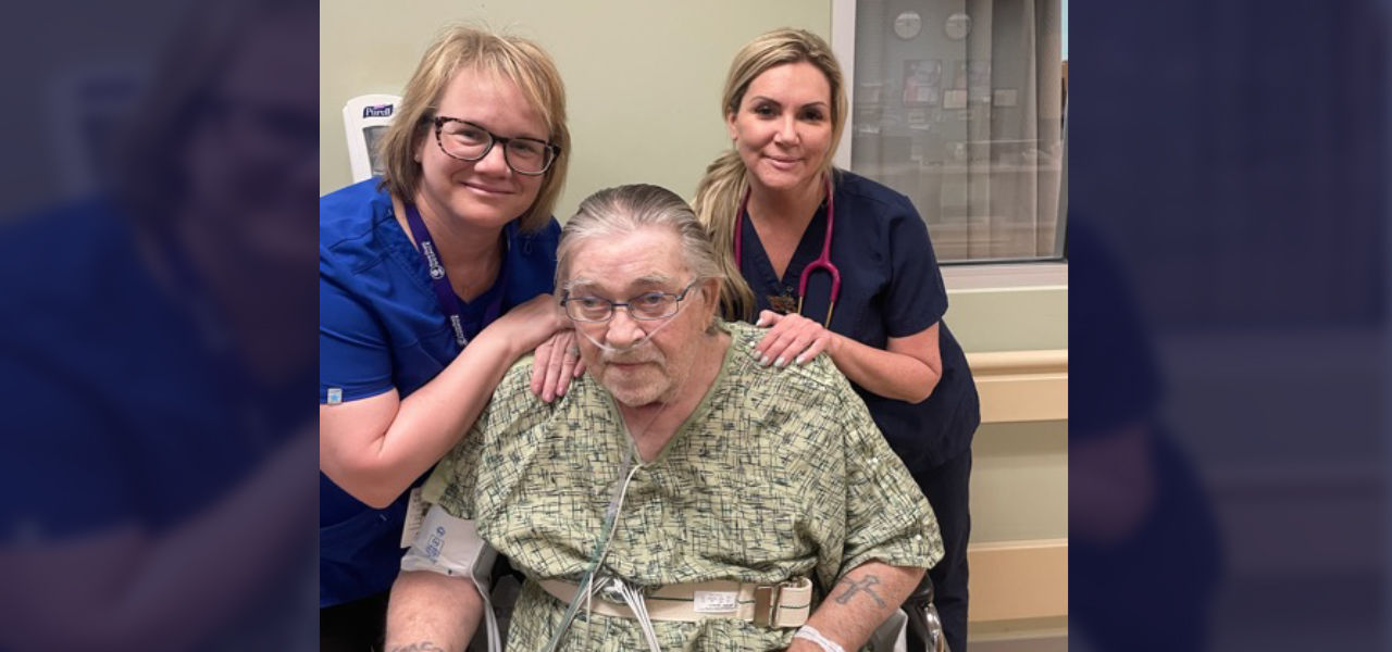 Happy patient leaving hospital with caregivers