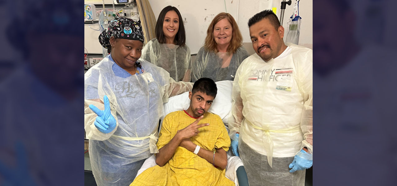 Happy patient leaving hospital with caregivers