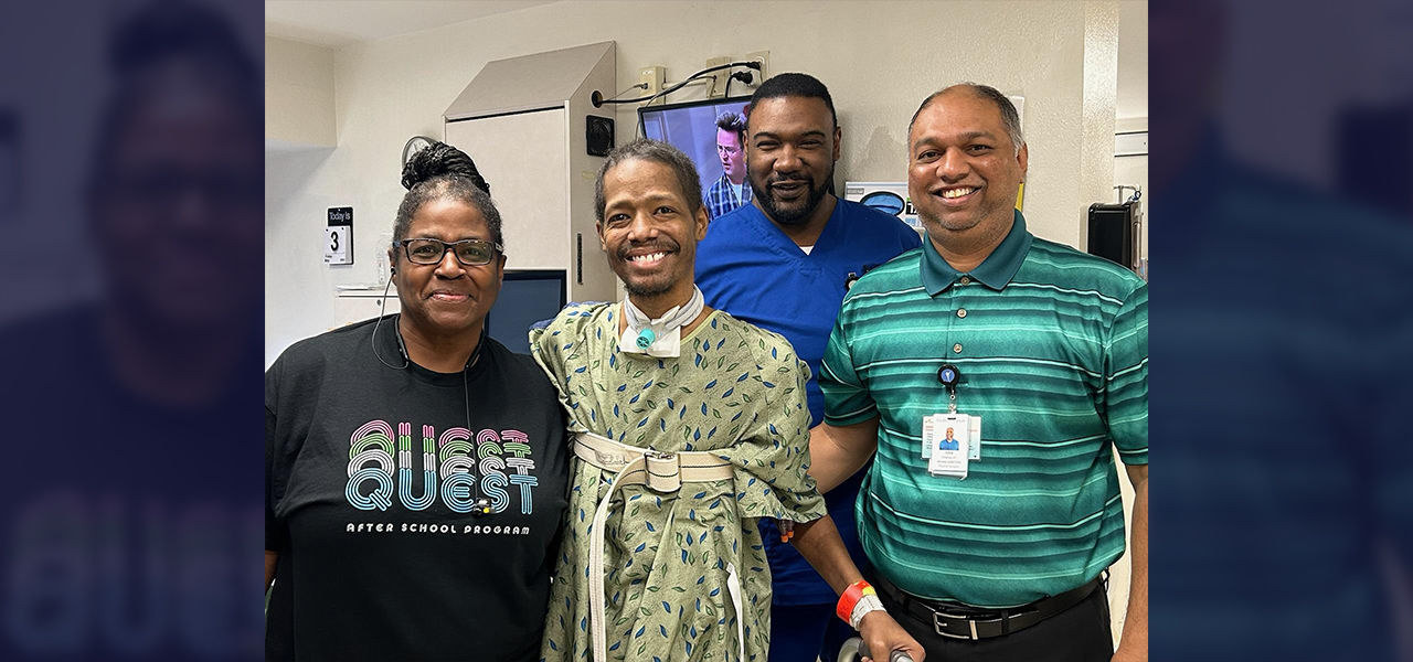 Happy patient leaving hospital with caregivers