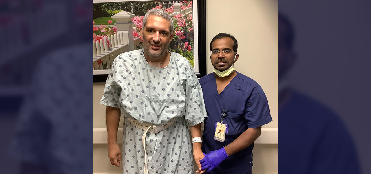 Happy patient leaving hospital with caregivers