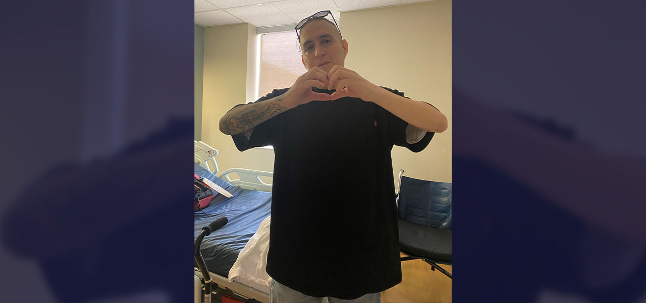Happy patient leaving hospital with caregivers