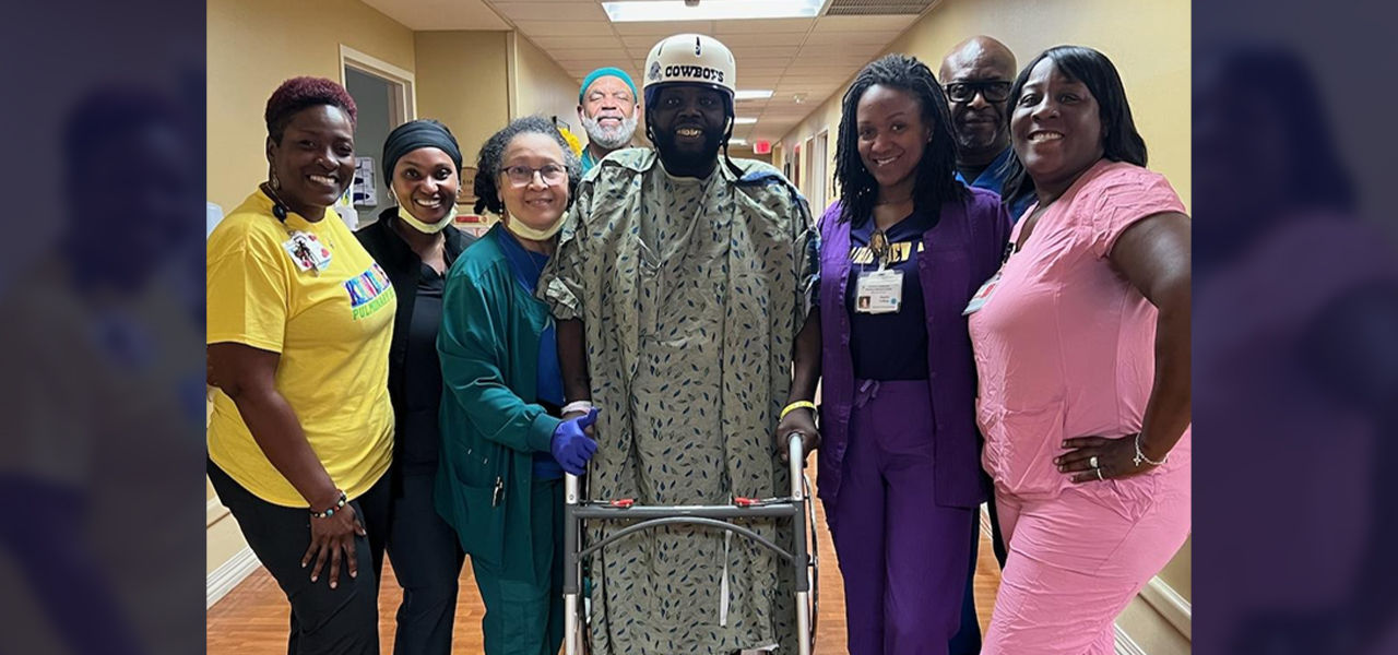 Happy patient leaving hospital with caregivers