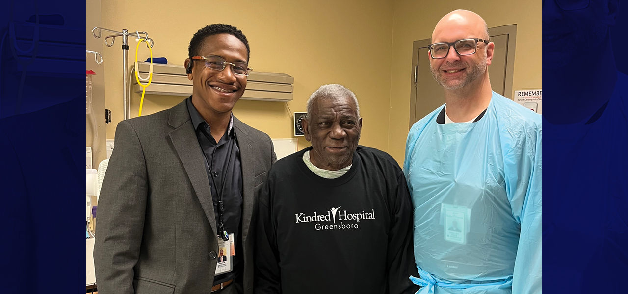 Kindred Hospital Greensboro patient Leroy poses with his care team