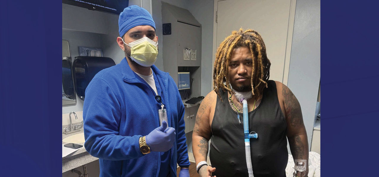 Kindred Hospital Central Tampa patient Maikel stands and poses with his caregiver