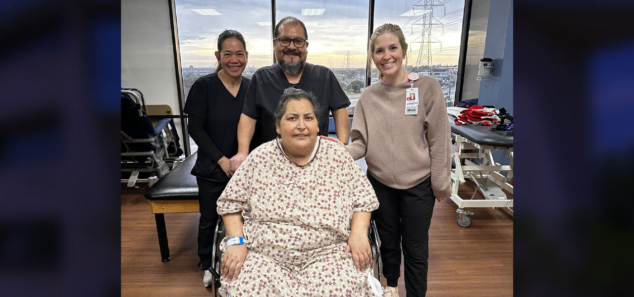 Kindred Hospital San Antonio patient Maria sits with her care team